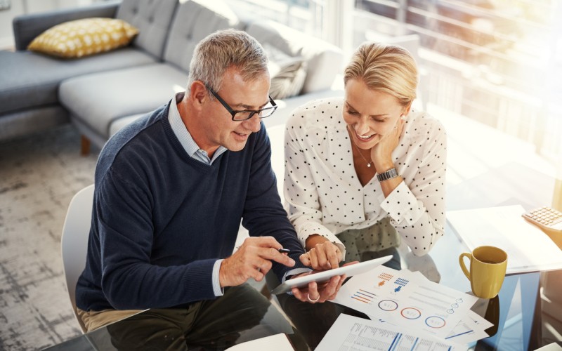 Man and woman at desk reviewing documents