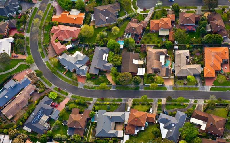 street photo looking down on road and houses