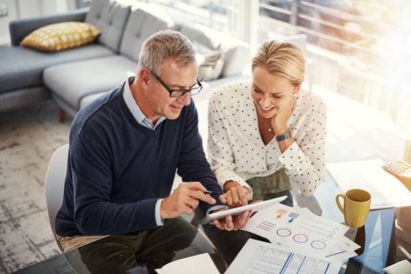 Man and woman at desk reviewing documents